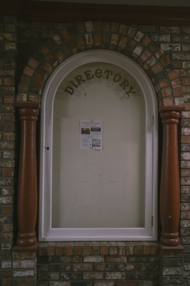 a brick arch with a newspaper on it